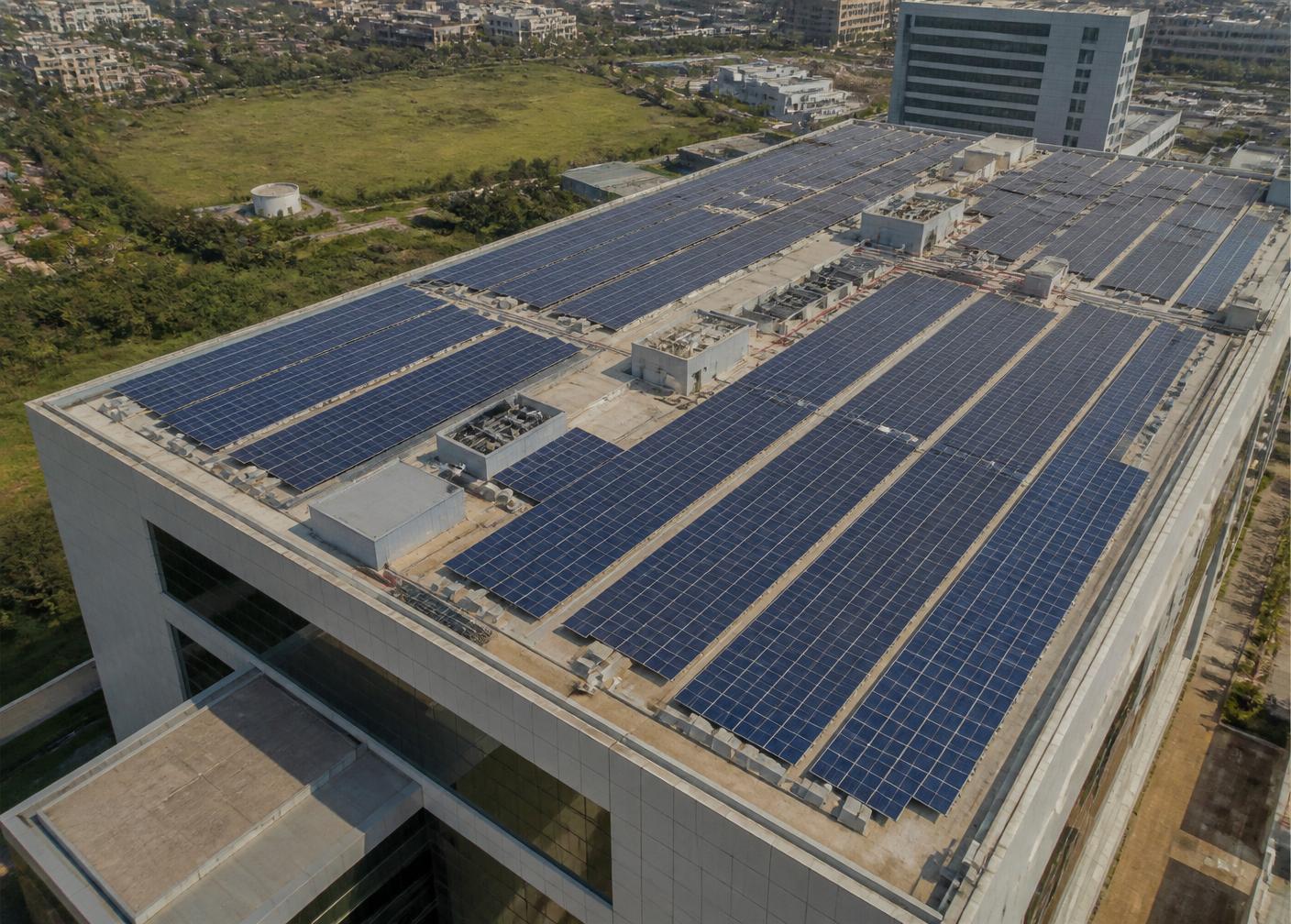 Large solar array across a commercial building rooftop